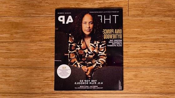 《the Wrap》杂志的鸟瞰图. The magazine cover is a picture of Gina Prince-Bythewood, a women with brown hair wearing a brown and beige blazer.