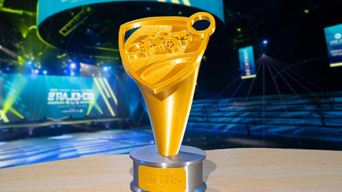 Gold High School Esports Scholar's Cup Champions first place trophy featuring 'Rocket League' logo.